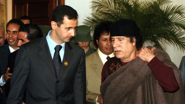 In this March 22, 2005 file photo, Syrian President Bashar Assad, left, talks to Libyan leader Moammar Gadhafi prior the 17th League of Arab States' summit in Algiers, Algeria. In this March 22, 2005 file photo, Syrian President Bashar Assad, left, talks to Libyan leader Moammar Gadhafi prior the 17th League of Arab States' summit in Algiers, Algeria. - Sputnik International