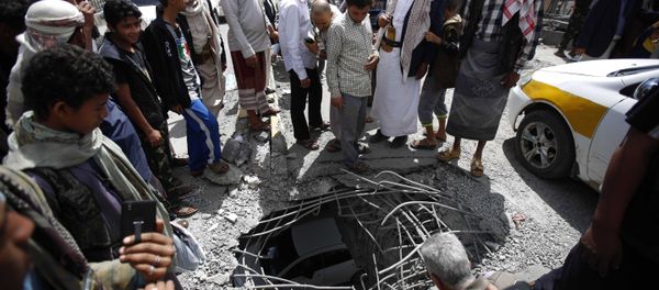 People stand around damages made by a Saudi-led airstrike on a bridge in Sanaa, Yemen, Wednesday, March 23, 2016. Yemen has been left fragmented by war pitting Shiite Houthi rebels and military units loyal to a former president against a US-backed, Saudi-led coalition supporting the internationally recognized government. People stand around damages made by a Saudi-led airstrike on a bridge in Sanaa, Yemen, Wednesday, March 23, 2016. Yemen has been left fragmented by war pitting Shiite Houthi rebels and military units loyal to a former president against a US-backed, Saudi-led coalition supporting the internationally recognized government. - Sputnik International