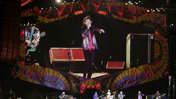 Mick Jagger of the Rolling Stones is seen on a giant screen as he performs during a free outdoor concert at Ciudad Deportiva de la Habana sports complex in Havana, March 25, 2016. - Sputnik International