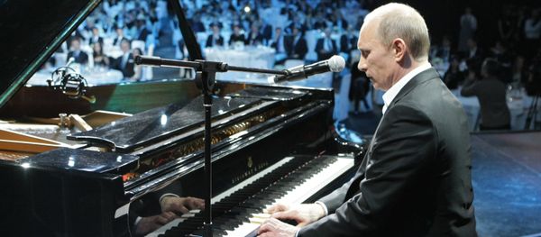 Russian President Vladimir Putin (then Prime Minister) plays the piano at a charity concert for children stricken with cancer and eye diseases held at St. Petersburg's Ice Palace, December 10, 2010. - Sputnik International