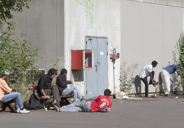 Migrants rest in the grounds of the Guillaume-Bude secondary school building in Paris. (File) Migrants rest in the grounds of the Guillaume-Bude secondary school building in Paris. (File) - Sputnik International
