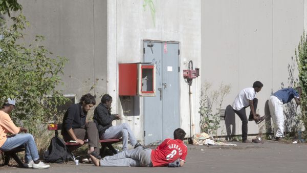 Migrants rest in the grounds of the Guillaume-Bude secondary school building in Paris. (File) Migrants rest in the grounds of the Guillaume-Bude secondary school building in Paris. (File) - Sputnik International