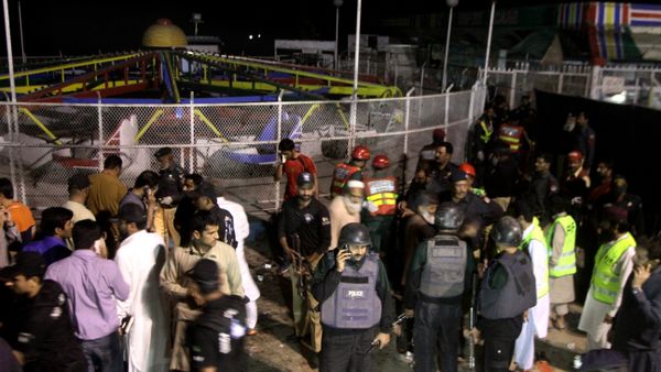 Pakistani police officers and rescue workers gather at the site of bomb explosion in a park in Lahore, Pakistan Pakistani police officers and rescue workers gather at the site of bomb explosion in a park in Lahore, Pakistan - Sputnik International