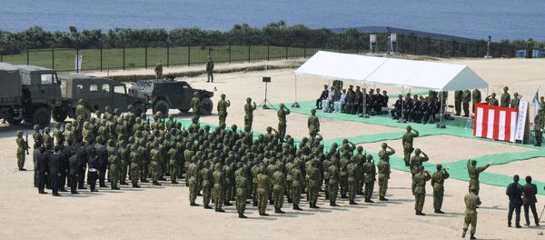 Members of Japan's Self Defence Force hold an opening ceremony of a new military base on the island of Yonaguni in the Okinawa prefecture, March 28, 2016. - Sputnik International