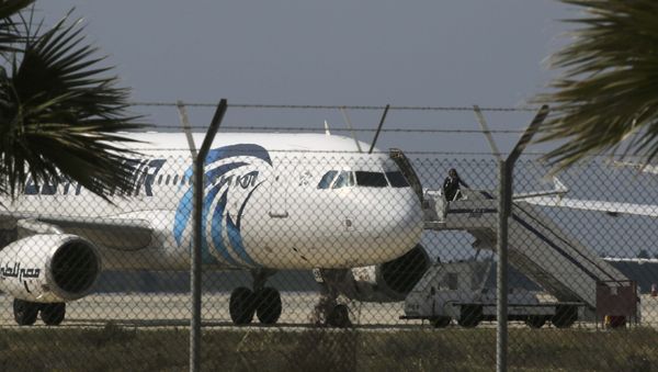 An official boards a hijacked Egyptair A320 Airbus at Larnaca Airport in Larnaca, Cyprus, March 29, 2016 An official boards a hijacked Egyptair A320 Airbus at Larnaca Airport in Larnaca, Cyprus, March 29, 2016 - Sputnik International