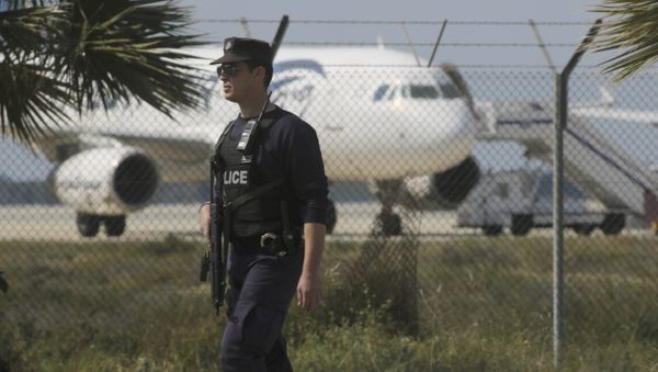 Police stand guard at Larnaca Airport near a hijacked Egyptair Airbus A320 , March 29, 2016 Police stand guard at Larnaca Airport near a hijacked Egyptair Airbus A320 , March 29, 2016 - Sputnik International