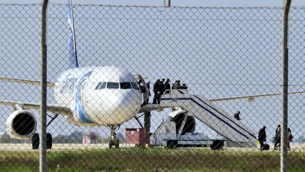 Passengers evacuate a hijacked EgyptAir Airbus 320 plane at Larnaca airport, Cyprus, March 29, 2016 Passengers evacuate a hijacked EgyptAir Airbus 320 plane at Larnaca airport, Cyprus, March 29, 2016 - Sputnik International