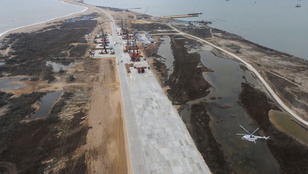 A bird's eye view of the Tuzla Island where construction of a bridge across the Kerch Strait takes place. March 18, 2016. A bird's eye view of the Tuzla Island where construction of a bridge across the Kerch Strait takes place. March 18, 2016. - Sputnik International