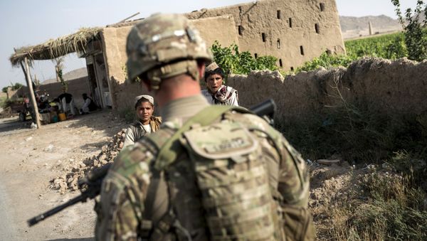 A US soldier patrols near Kandahar Airfield. file photo A US soldier patrols near Kandahar Airfield. file photo - Sputnik International