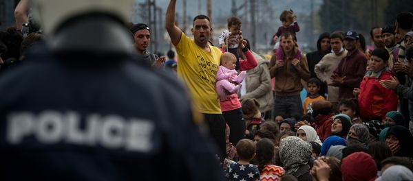 Yazidi refugees protest to call for the reopening of the borders at a makeshift camp at the Greek-Macedonian border near the village of Idomeni on March 21, 2016 Yazidi refugees protest to call for the reopening of the borders at a makeshift camp at the Greek-Macedonian border near the village of Idomeni on March 21, 2016 - Sputnik International