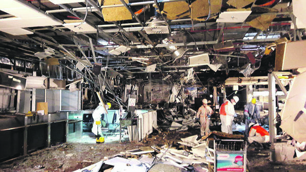 Damage is seen inside the departure terminal following the March 22, 2016 bombing at Zaventem Airport, in these undated photos made available to Reuters by the Belgian newspaper Het Nieuwsblad, in Brussels, Belgium, March 29, 2016 - Sputnik International