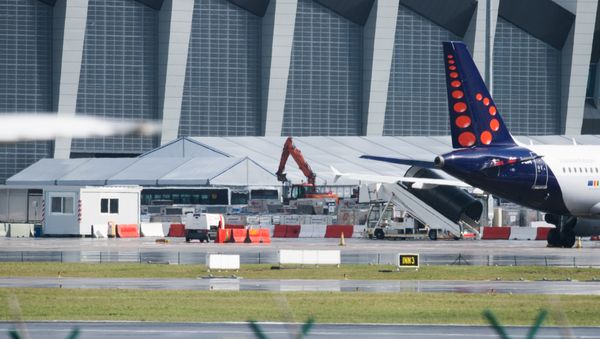 A picture taken on March 29, 2016 in Zaventem shows tents at Brussels Airport, where authorities are running a series of tests to see if makeshift check-in facilities are good enough to restart some flights and that repair work and new security measures are adequate after the deadly March 22 attacks - Sputnik International