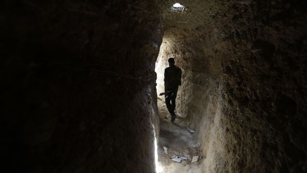A Syrian army soldier makes his way in a tunnel reportedly previously used by rebel fighters in Jobar, a mostly rebel-held area on the eastern outskirts of Damascus on June 2, 2014 A Syrian army soldier makes his way in a tunnel reportedly previously used by rebel fighters in Jobar, a mostly rebel-held area on the eastern outskirts of Damascus on June 2, 2014 - Sputnik International