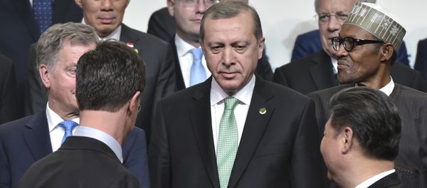 Netherlands Prime Minister Mark Rutte (front, L) and China's President Xi Jinping (front R) look at Turkey's President Recep Tayyip Erdogan (C) while posing in the Nuclear Security Summit family photo at the Walter E. Washington Convention Center on April 1, 2016 in Washington, DC. Netherlands Prime Minister Mark Rutte (front, L) and China's President Xi Jinping (front R) look at Turkey's President Recep Tayyip Erdogan (C) while posing in the Nuclear Security Summit family photo at the Walter E. Washington Convention Center on April 1, 2016 in Washington, DC. - Sputnik International