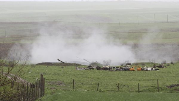 An Armenian artillery unit is seen in the town of Martakert, where clashes with Azeri forces are taking place, in Nagorno-Karabakh region, which is controlled by separatist Armenians, April 3, 2016. An Armenian artillery unit is seen in the town of Martakert, where clashes with Azeri forces are taking place, in Nagorno-Karabakh region, which is controlled by separatist Armenians, April 3, 2016. - Sputnik International