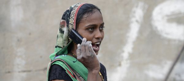 An Indian woman speaks on a mobile phone An Indian woman speaks on a mobile phone - Sputnik International