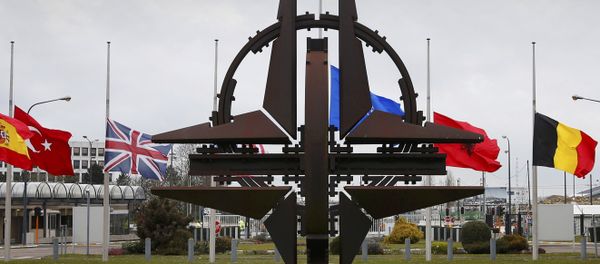 Flags fly at half mast at NATO headquarters in Brussels, March 23, 2016. - Sputnik International