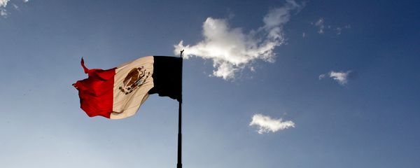 A Mexican flag flutters at the Zocalo square in Mexico City, on April 29, 2009. The World Health Organisation raised its flu alert to phase five out of six, WHO chief Margaret Chan said, signalling that a pandemic was imminent following the swine flu outbreak. A Mexican flag flutters at the Zocalo square in Mexico City, on April 29, 2009. The World Health Organisation raised its flu alert to phase five out of six, WHO chief Margaret Chan said, signalling that a pandemic was imminent following the swine flu outbreak. - Sputnik International