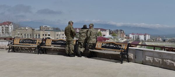 Uniformed men in Stepanakert, the unrecognized Nagorno-Karabakh Republic Uniformed men in Stepanakert, the unrecognized Nagorno-Karabakh Republic - Sputnik International