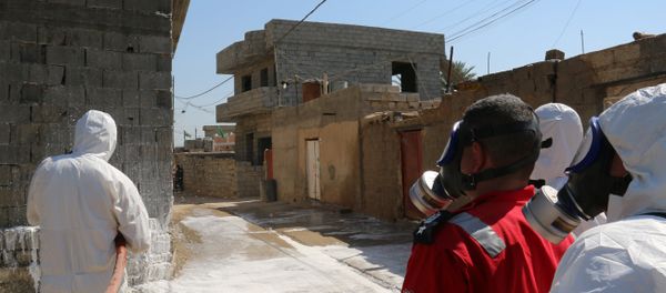 Members of the civil defence spray and clean areas in the town of Taza, around 220 kilometres north of the capital Baghdad, on March 13, 2016, that might have been contaminated in a chemical attack carried out by the Islamic State (IS) group the previous week Members of the civil defence spray and clean areas in the town of Taza, around 220 kilometres north of the capital Baghdad, on March 13, 2016, that might have been contaminated in a chemical attack carried out by the Islamic State (IS) group the previous week - Sputnik International
