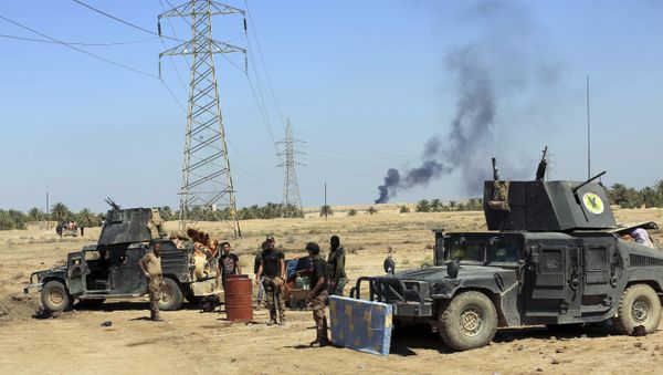 Smoke rises from Islamic State positions following a U.S.-led coalition airstrike as Iraqi Security forces surround the town of Hit, 85 miles (140 kilometers) west of Baghdad, Iraq, Saturday, April 2, 2016 Smoke rises from Islamic State positions following a U.S.-led coalition airstrike as Iraqi Security forces surround the town of Hit, 85 miles (140 kilometers) west of Baghdad, Iraq, Saturday, April 2, 2016 - Sputnik International