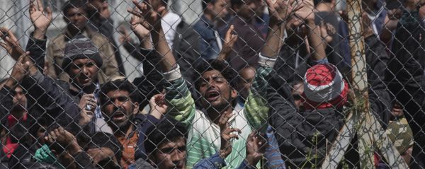 Migrants, most of them from Pakistan, protest against the EU-Turkey deal on migration inside the entrance of Moria camp in the Greek island of Lesbos on April 5, 2016 - Sputnik International