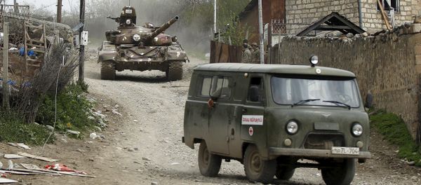 A tank of the self-defense army of Nagorno-Karabakh moves on the road in the village of Talish April 6, 2016 - Sputnik International