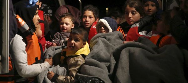 Refugee children are seen onboard a Greek Coast Guard vessel, carrying other refugees and migrants, as it arrives at the port of Mytilene on the Greek island of Lesbos, following a rescue operation at open sea, April 5, 2016 Refugee children are seen onboard a Greek Coast Guard vessel, carrying other refugees and migrants, as it arrives at the port of Mytilene on the Greek island of Lesbos, following a rescue operation at open sea, April 5, 2016 - Sputnik International