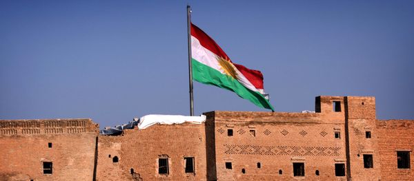A picture taken on February 3, 2016, shows the Kurdish flag flying over the Arbil Citadel, in the capital of the autonomous Kurdish region of northern Iraq - Sputnik International