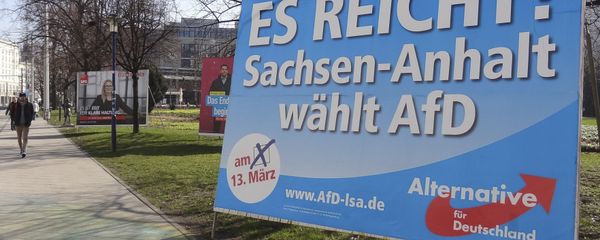 A man walks past a campaign poster of right-populist AfD party reading It's enough - Saxony-Anhalt elects AfD in Magdeburg, Germany. A man walks past a campaign poster of right-populist AfD party reading It's enough - Saxony-Anhalt elects AfD in Magdeburg, Germany. - Sputnik International