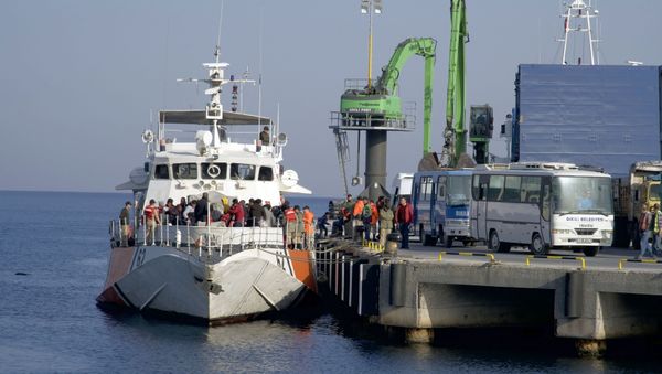 (File) Migrants disembark after they were apprehended by the Turkish coast guard on the Aegean Sea between Turkey and Greece, in Dikili port, Turkey, Wednesday, April 6, 2016 (File) Migrants disembark after they were apprehended by the Turkish coast guard on the Aegean Sea between Turkey and Greece, in Dikili port, Turkey, Wednesday, April 6, 2016 - Sputnik International