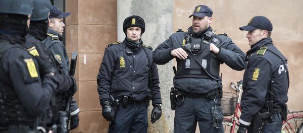 Danish policemen stand guard in front of the city court in Copenhagen, Denmark Danish policemen stand guard in front of the city court in Copenhagen, Denmark - Sputnik International