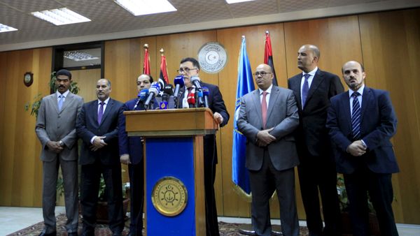 Libyan prime minister-designate under a proposed National Unity government Fayez Seraj (C) attends a news conference in Tripoli, Libya, March 30, 2016 - Sputnik International