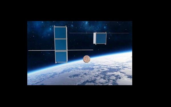 Two FemtoSat models, compared to the size of a penny. Two FemtoSat models, compared to the size of a penny. - Sputnik International