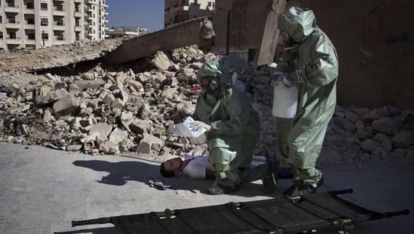 Volunteers take part in a simulation of how to respond to a chemical attack, in the northern Syrian city of Aleppo (File) Volunteers take part in a simulation of how to respond to a chemical attack, in the northern Syrian city of Aleppo (File) - Sputnik International