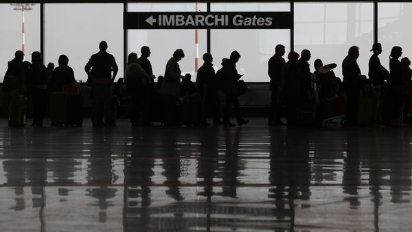 Passengers queue at a check in area of the Milan's Malpensa international airport, in Busto Arsizio, Italy, Tuesday, March 22, 2016 Passengers queue at a check in area of the Milan's Malpensa international airport, in Busto Arsizio, Italy, Tuesday, March 22, 2016 - Sputnik International
