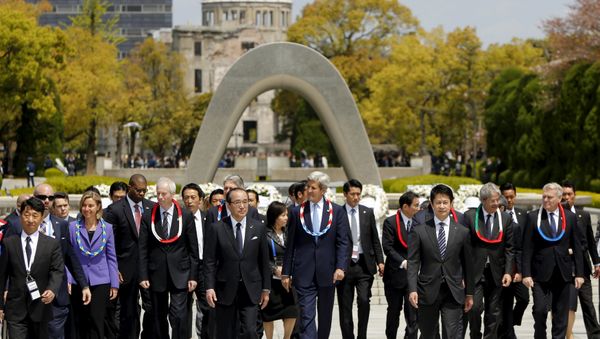 G7 foreign ministers EU High Representative for Foreign Affairs Federica Mogherini (from L, in decorative necklaces), Canada's Foreign Minister Stephane Dion, Britain's Foreign Minister Philip Hammond (obscured), US Secretary of State John Kerry, Japan's Foreign Minister Fumio Kishida (obscured), Italy's Foreign Minister Paolo Gentiloni and France's Foreign Minister Jean-Marc Ayrault walk together after placing wreaths at the cenotaph at Hiroshima Peace Memorial Park and Museum in Hiroshima, Japan April 11, 2016. G7 foreign ministers EU High Representative for Foreign Affairs Federica Mogherini (from L, in decorative necklaces), Canada's Foreign Minister Stephane Dion, Britain's Foreign Minister Philip Hammond (obscured), US Secretary of State John Kerry, Japan's Foreign Minister Fumio Kishida (obscured), Italy's Foreign Minister Paolo Gentiloni and France's Foreign Minister Jean-Marc Ayrault walk together after placing wreaths at the cenotaph at Hiroshima Peace Memorial Park and Museum in Hiroshima, Japan April 11, 2016. - Sputnik International