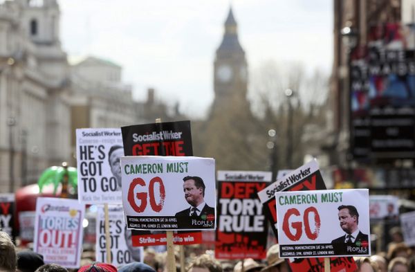 Demonstrators hold placards during a protest outside Downing Street in Whitehall, central London, Britain April 9, 2016. Demonstrators hold placards during a protest outside Downing Street in Whitehall, central London, Britain April 9, 2016. - Sputnik International