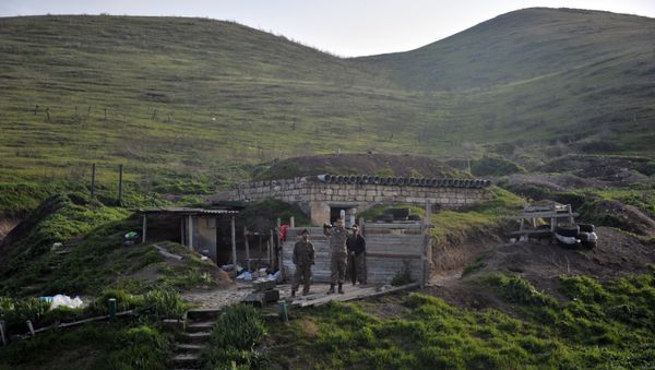 Troops of the the Nagorno-Karabakh army are on the first line of defense at a makeshift model of a church they use as an altar - Sputnik International