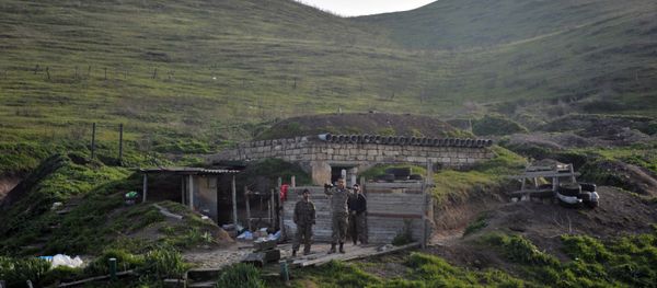 Troops of the the Nagorno-Karabakh army are on the first line of defense at a makeshift model of a church they use as an altar Troops of the the Nagorno-Karabakh army are on the first line of defense at a makeshift model of a church they use as an altar - Sputnik International