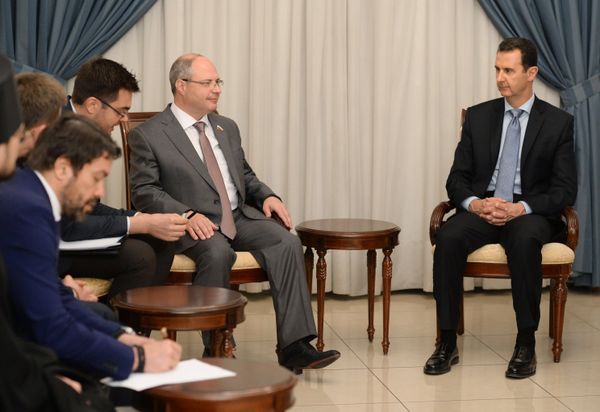 Syrian President Bashar al-Assad, right, meets with Russian parliamentary delegation in Damascus Syrian President Bashar al-Assad, right, meets with Russian parliamentary delegation in Damascus - Sputnik International