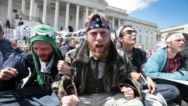 Voting rights reform demonstrators stage a sit-in at the Capitol in Washington, Monday, April 11, 2016, urging lawmakers to take money out of the political process. - Sputnik International