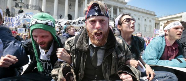 Voting rights reform demonstrators stage a sit-in at the Capitol in Washington, Monday, April 11, 2016, urging lawmakers to take money out of the political process. - Sputnik International