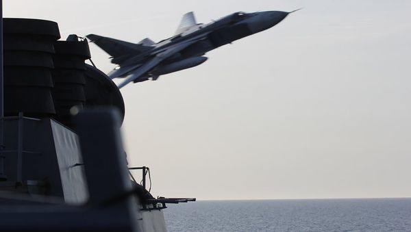 An undated US Navy picture shows what appears to be a Russian Sukhoi SU-24 attack aircraft making a very low pass close to the U.S. guided missile destroyer USS Donald Cook in the Baltic Sea. An undated US Navy picture shows what appears to be a Russian Sukhoi SU-24 attack aircraft making a very low pass close to the U.S. guided missile destroyer USS Donald Cook in the Baltic Sea. - Sputnik International