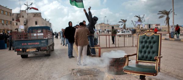 Benghazi residents waving the state flag. File photo Benghazi residents waving the state flag. File photo - Sputnik International