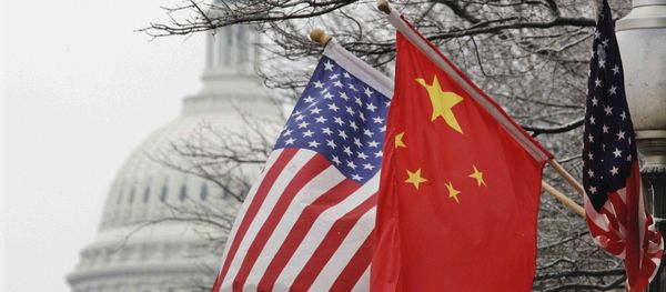 The Capitol dome is seen at rear as Chinese and U.S. flags are displayed in Washington, Tuesday, Jan. 18, 2011 The Capitol dome is seen at rear as Chinese and U.S. flags are displayed in Washington, Tuesday, Jan. 18, 2011 - Sputnik International