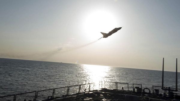 An U.S. Navy picture shows what appears to be a Russian Sukhoi SU-24 attack aircraft flying over the U.S. guided missile destroyer USS Donald Cook in the Baltic Sea in this picture taken April 12, 2016 and released April 13, 2016 An U.S. Navy picture shows what appears to be a Russian Sukhoi SU-24 attack aircraft flying over the U.S. guided missile destroyer USS Donald Cook in the Baltic Sea in this picture taken April 12, 2016 and released April 13, 2016 - Sputnik International