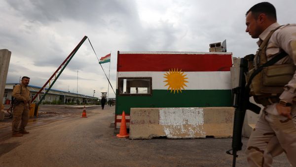 Members of the Iraqi Kurdish Peshmerga forces stand in Khazir near the Kurdish checkpoint of Aski Kalak, 40 kilometres West of Arbil, the capital of the autonomous Kurdish region of northern Iraq on April 12, 2016 Members of the Iraqi Kurdish Peshmerga forces stand in Khazir near the Kurdish checkpoint of Aski Kalak, 40 kilometres West of Arbil, the capital of the autonomous Kurdish region of northern Iraq on April 12, 2016 - Sputnik International