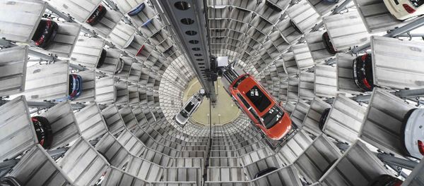 A VW Golf VII car (R) and a VW Passat are loaded in a delivery tower at the plant of German carmaker Volkswagen in Wolfsburg, Germany in this March 3, 2015 file picture. A VW Golf VII car (R) and a VW Passat are loaded in a delivery tower at the plant of German carmaker Volkswagen in Wolfsburg, Germany in this March 3, 2015 file picture. - Sputnik International
