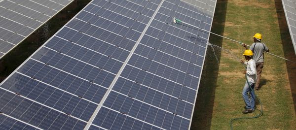 Workers clean photovoltaic panels inside a solar power plant in Gujarat, India (File) Workers clean photovoltaic panels inside a solar power plant in Gujarat, India (File) - Sputnik International
